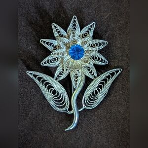 Silver Filigree Flower Brooch with Blue Gem